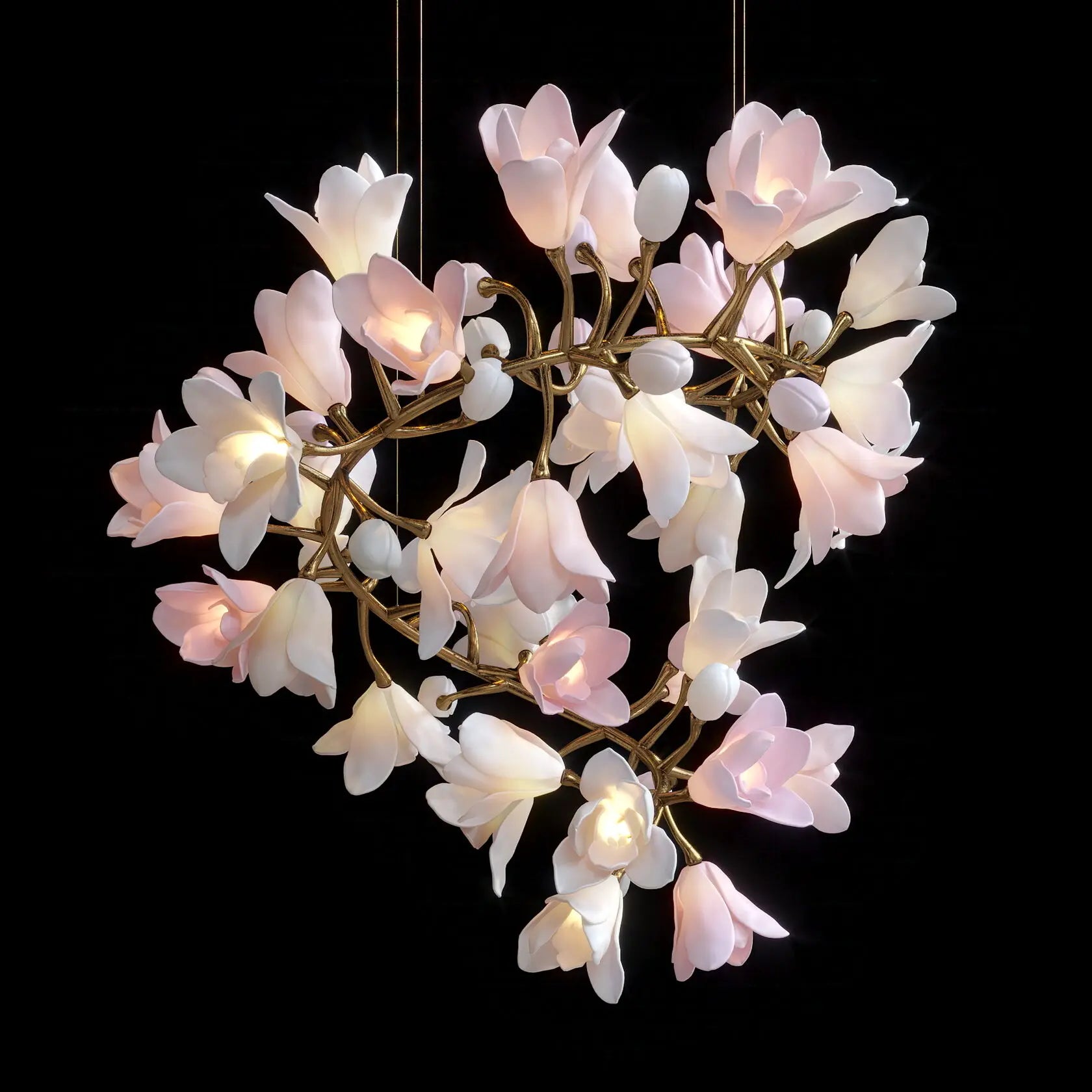 Ceramic flower chandelier with glowing white petals on antique gold metal branches