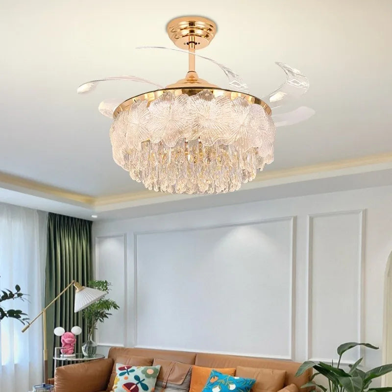 Gold crystal ceiling fan light with clear blades in a living room