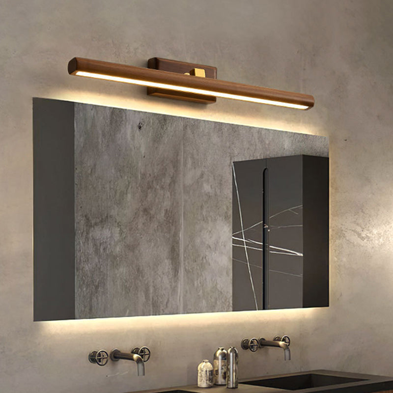 Nordic linear LED vanity light in dark wood above a bathroom mirror