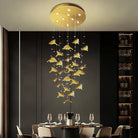 Gold ceiling canopy pendant chandelier with warm lights and hanging gold leaf glass pieces