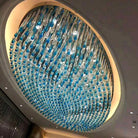 Large oval crystal chandelier with layered blue and clear hanging bead strands