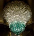 Brass-gold and teal oval crystal chandelier with long hanging bead curtains