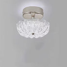 Chrome flush-mount ceiling light with clear crystal-style acrylic drum shade
