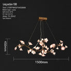 Long ceramic flower chandelier with pale pink and white petal lights on gold branches