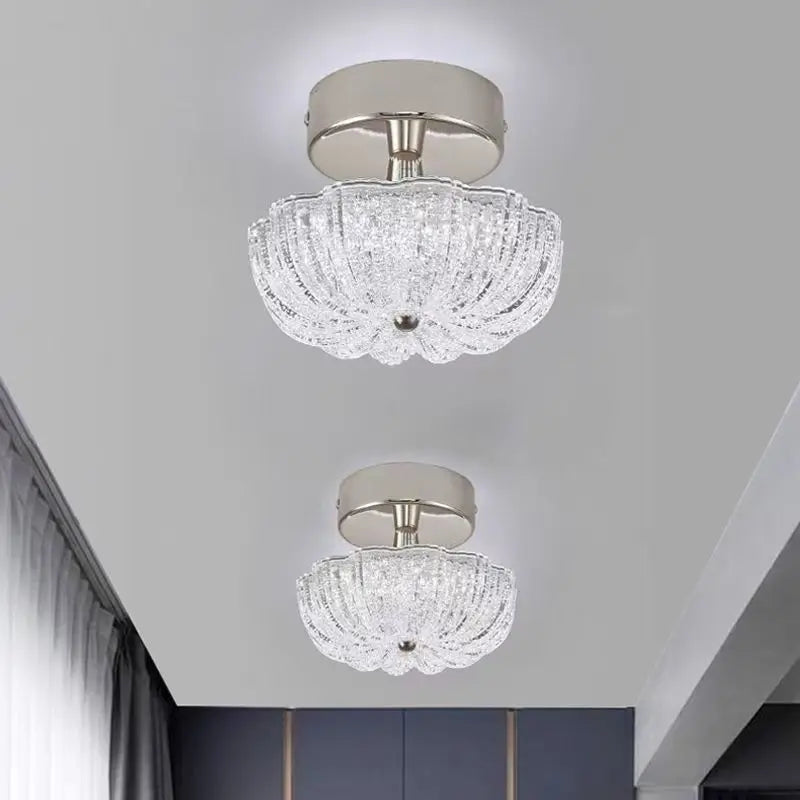 Chrome flush-mount ceiling light with clear crystal-style acrylic drum shade