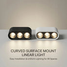 Curved surface-mount linear LED ceiling light, black and white housings with three bulbs