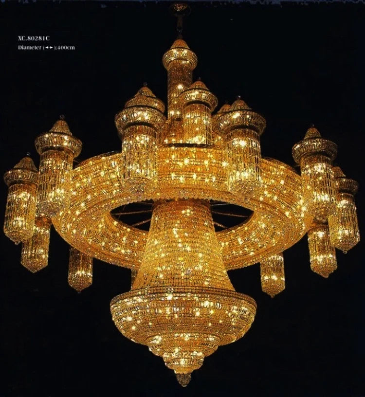 Gold crystal chandelier with domed tiers, hanging crystal lanterns, circular ring center