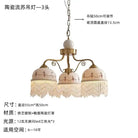 Three-head French-style pendant chandelier with white ceramic shades, brown accents, tassel fringe