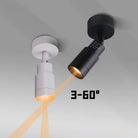 Surface-mounted adjustable LED zoom spotlight in black and white, angled warm beam