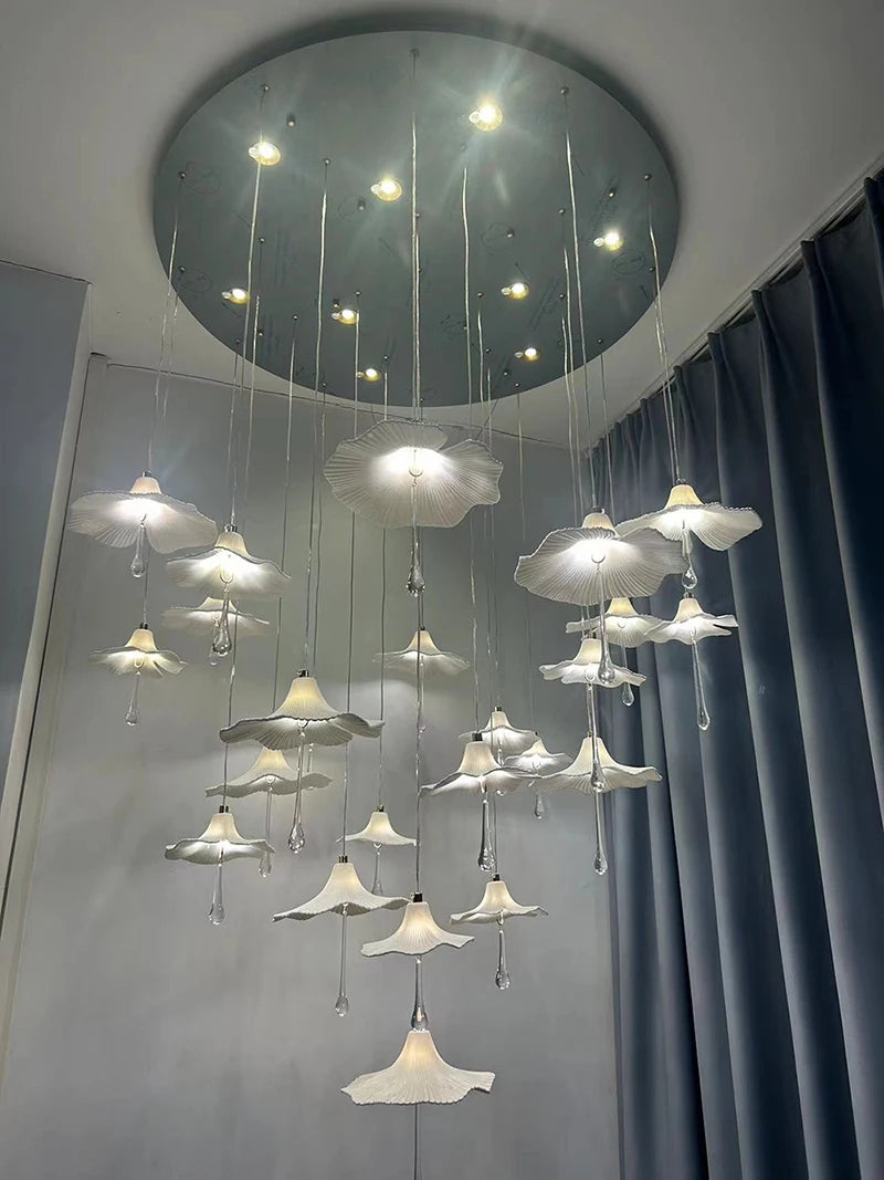 Mushroom-style ceramic chandelier with glowing white shades and hanging crystal drop accents