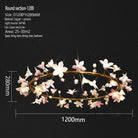 Round ceramic flower chandelier with glowing white petals and gold circular metal frame