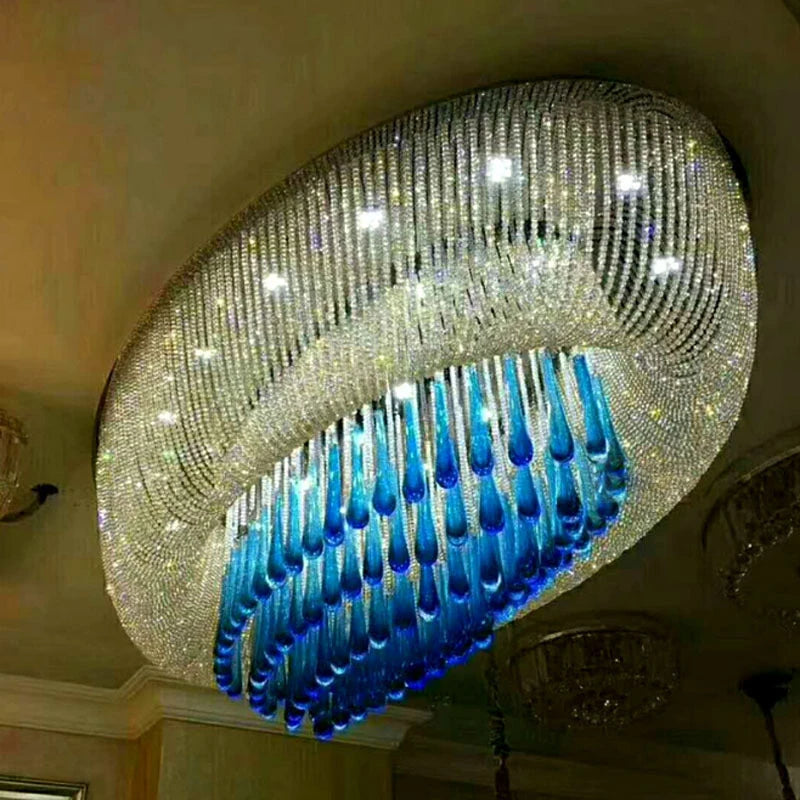 Gold oval crystal chandelier with glittering beads and a blue inner panel