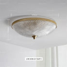 Round ceiling light with clear faceted glass shade and gold rim; 400mm shown