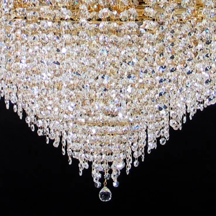 Ceiling chandelier detail: clear crystal drops and beads with gold-tone frame