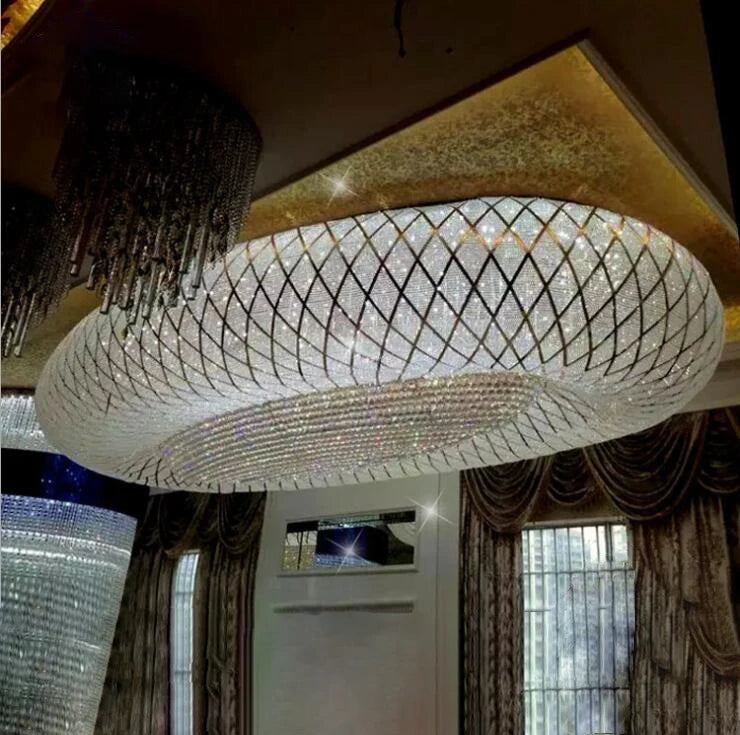 Oval crystal chandelier with white mesh frame and vertical hanging bead strands
